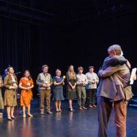 Dr. Danny Phipps and Fred Keller hugging on stage.